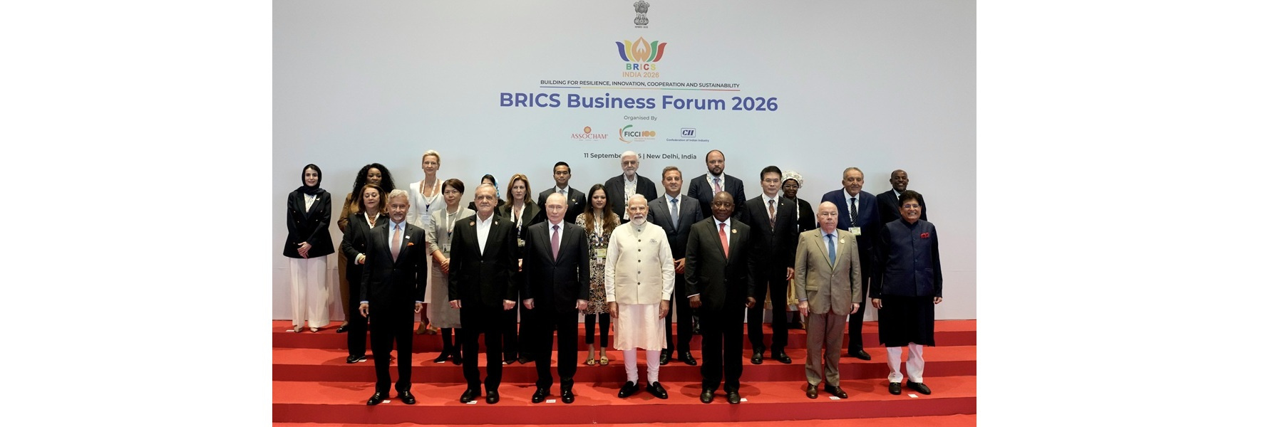 PM in a group photograph with BRICS leaders during the BRICS Business Forum 2026 on the sidelines of the 18th BRICS Summit at Bharat Mandapam, in New Delhi.