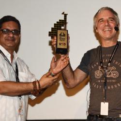 Festival Director sh. Chaitanya Prasad presenting Memento to Sh. Pierre Gill.